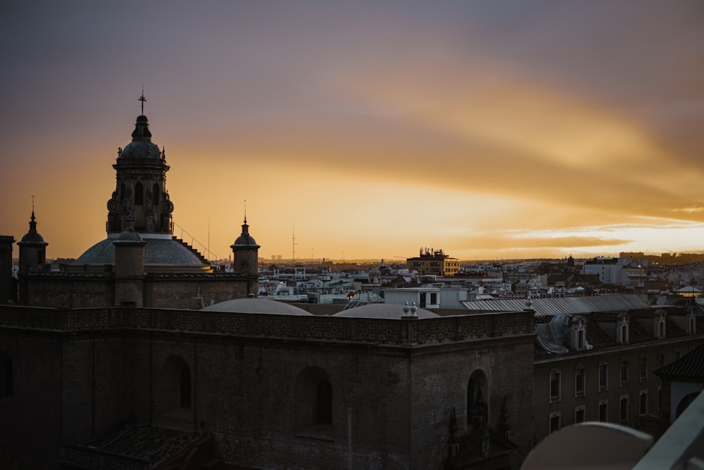 white and brown concrete building during sunset