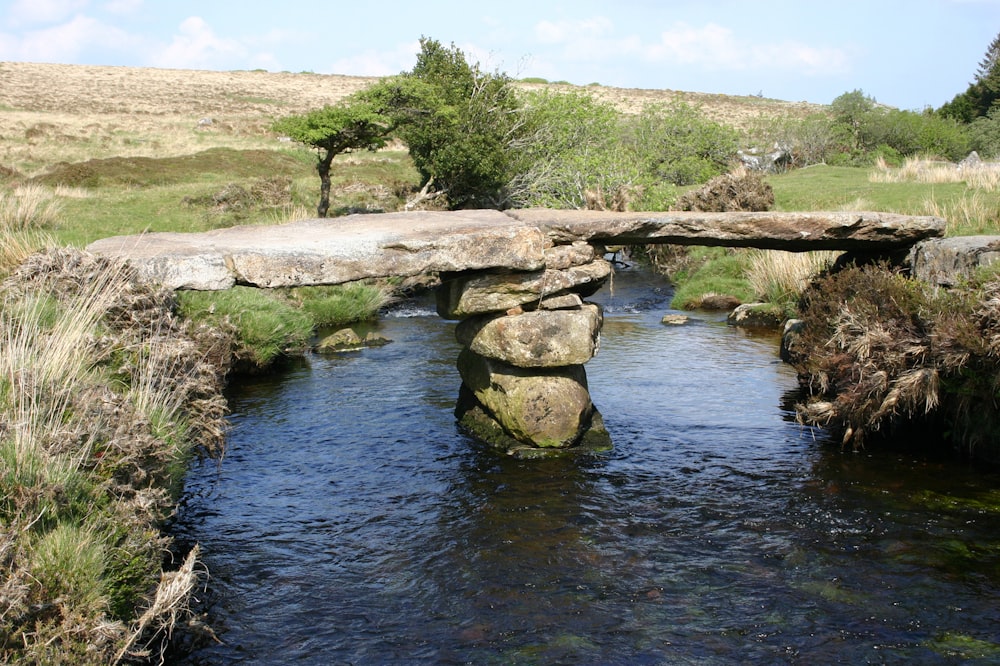 a small stone bridge over a small stream