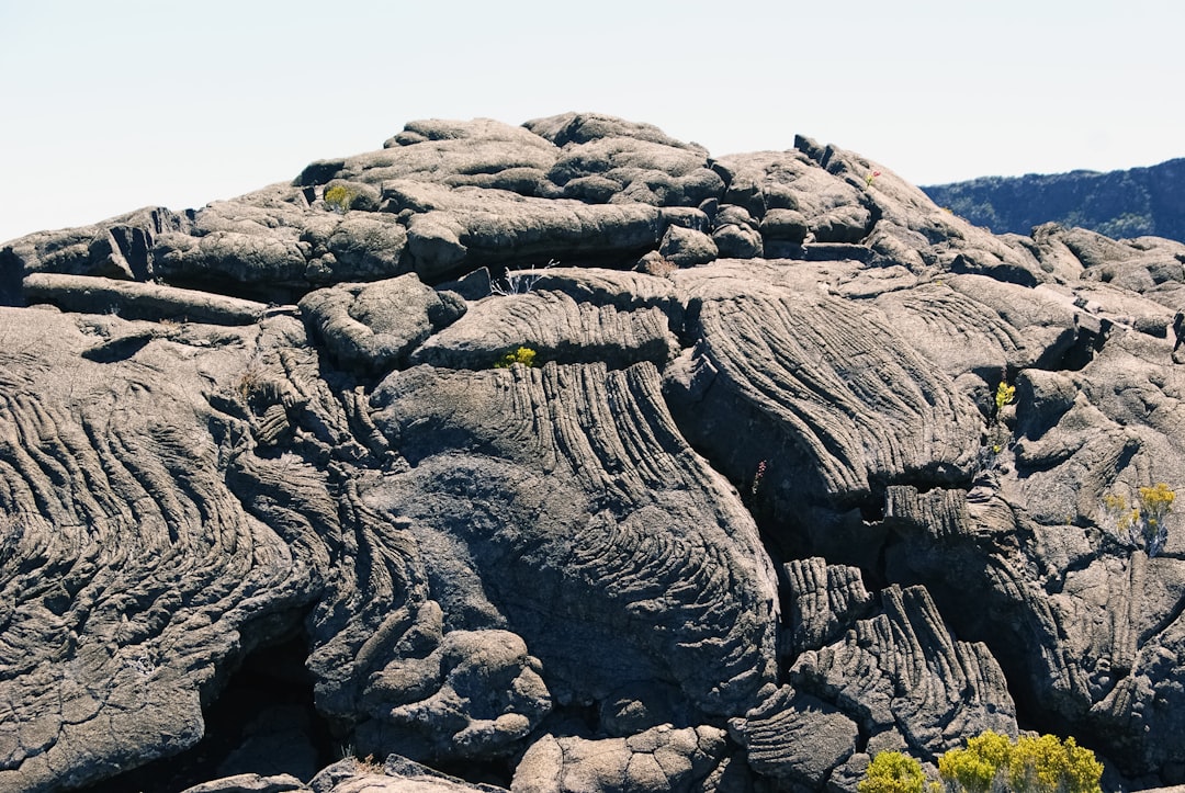 brown rock formation under white sky during daytime