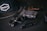 black semi automatic pistol beside black tube
