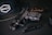 black semi automatic pistol beside black tube