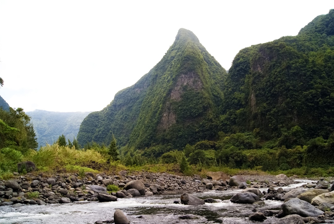 green mountain near river during daytime