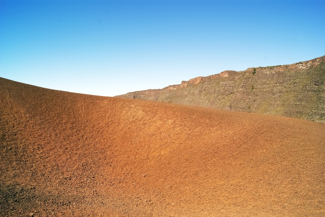 brown mountain under blue sky during daytime