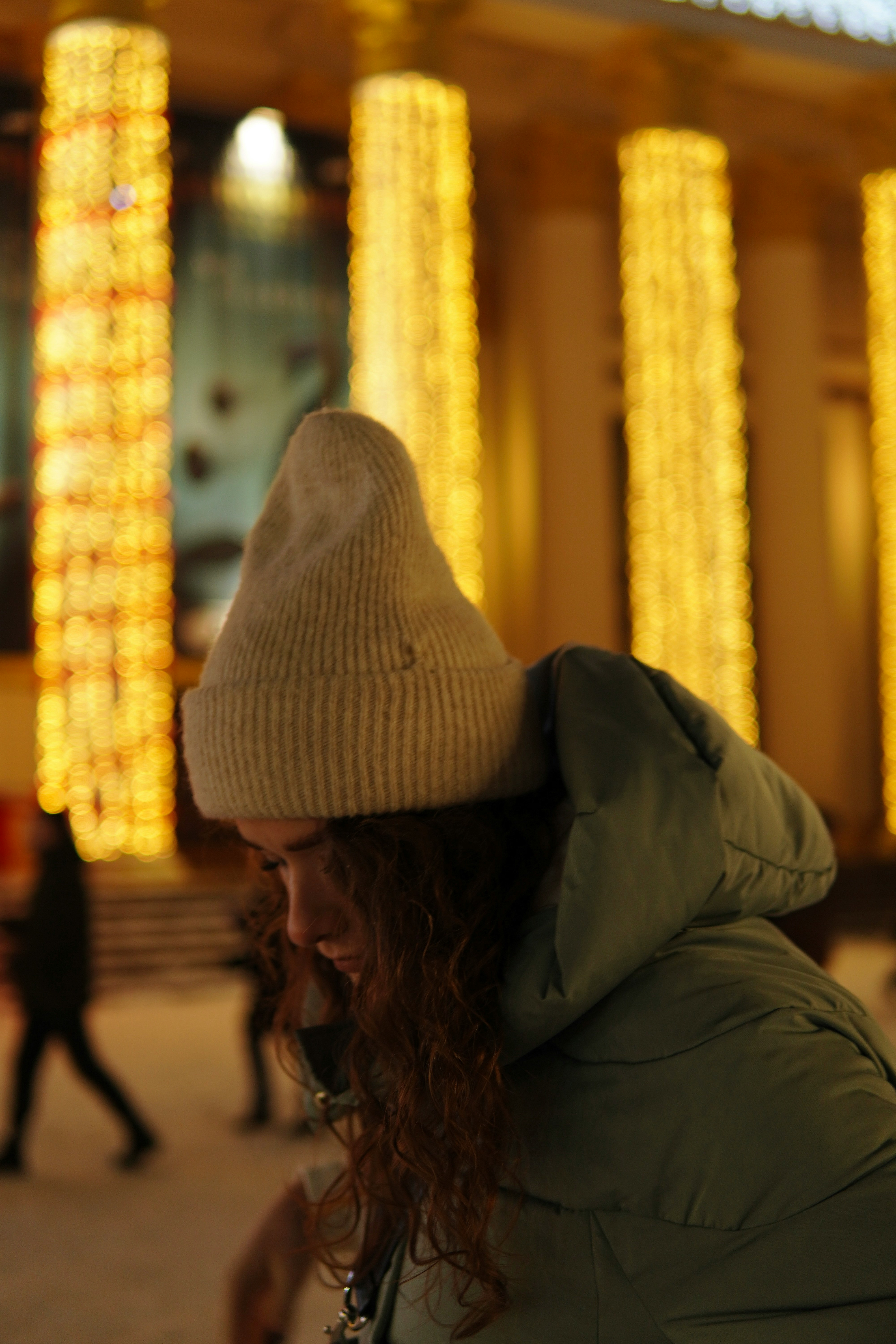 woman in gray knit cap and gray jacket