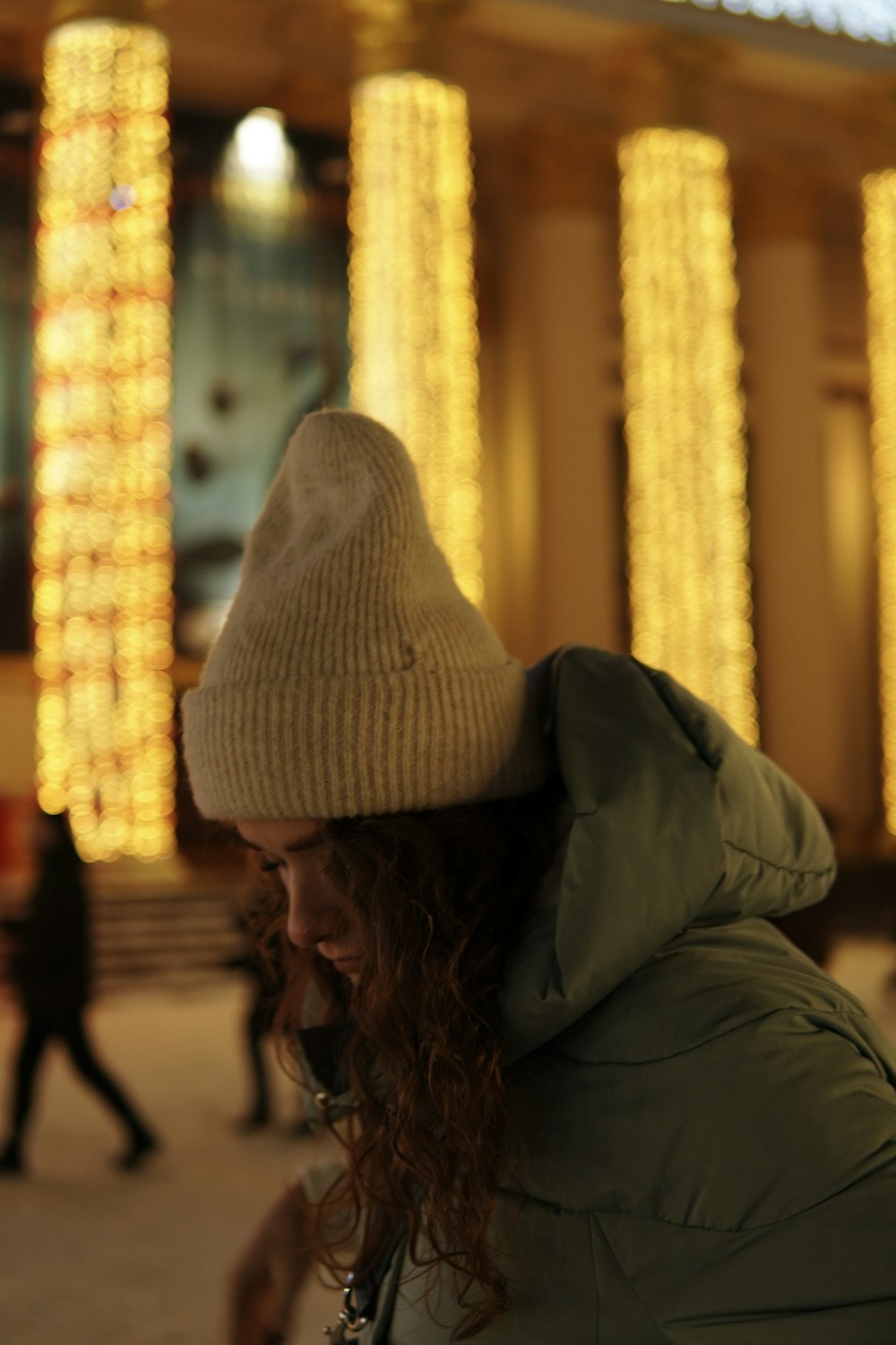 woman in gray knit cap and gray jacket