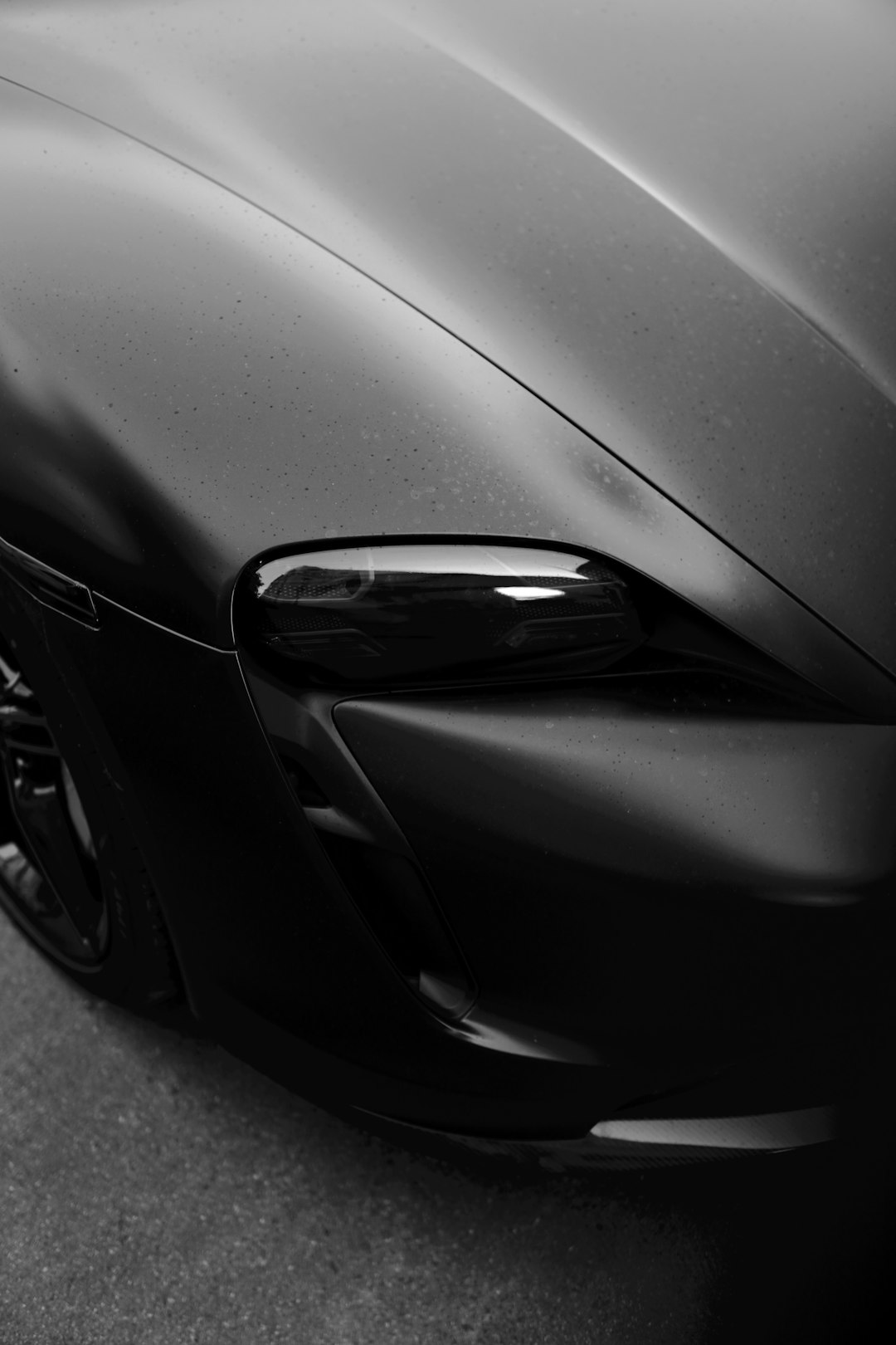 black car on gray asphalt road