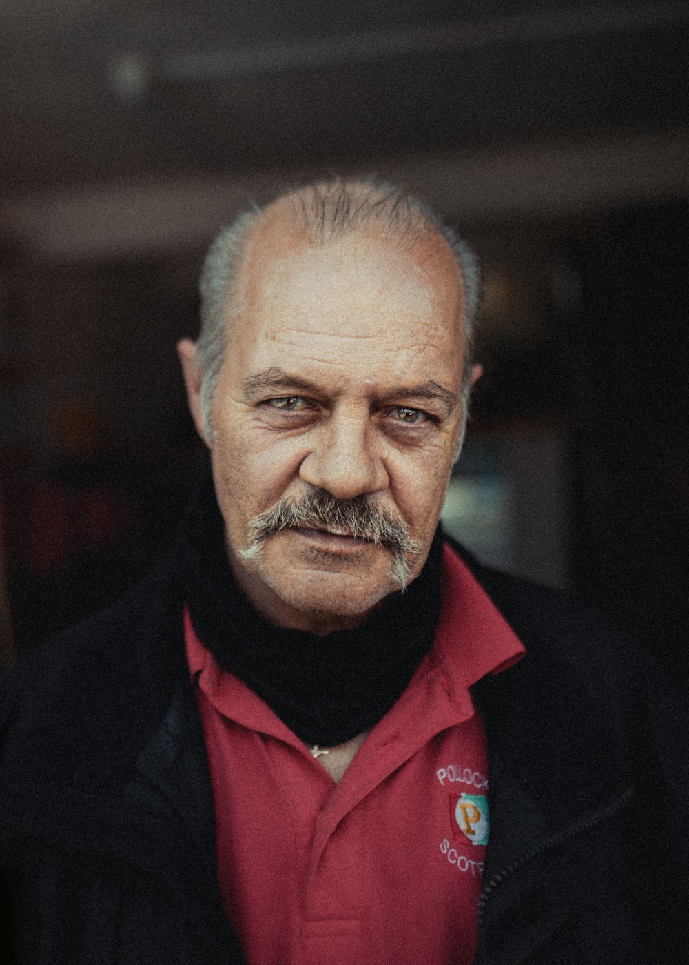 man in red and black suit