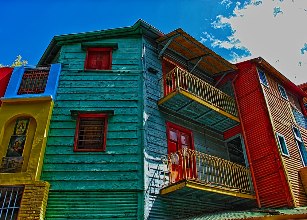 red and white wooden house under blue sky