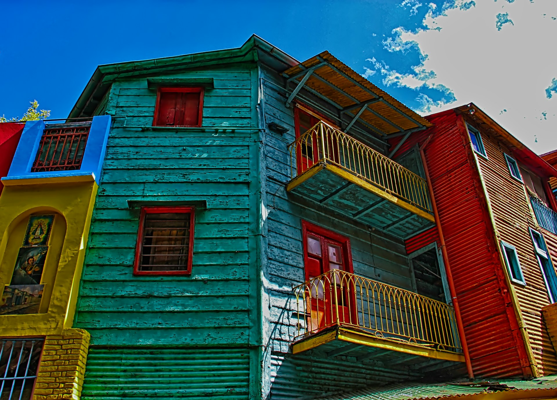 red and white wooden house under blue sky