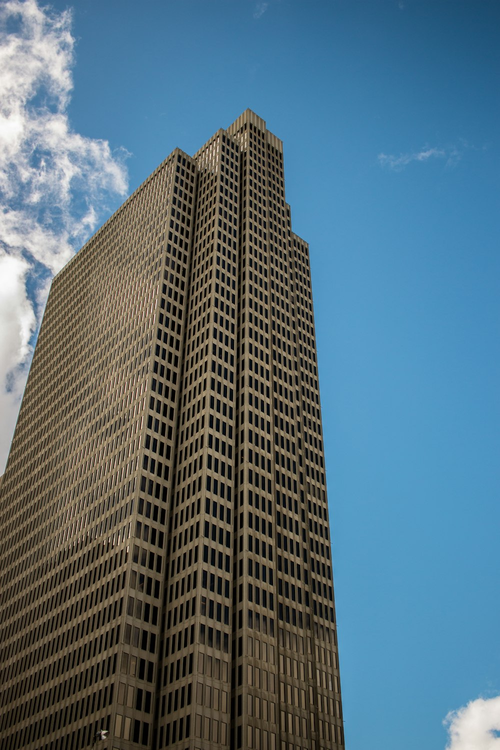 brown concrete building under blue sky during daytime