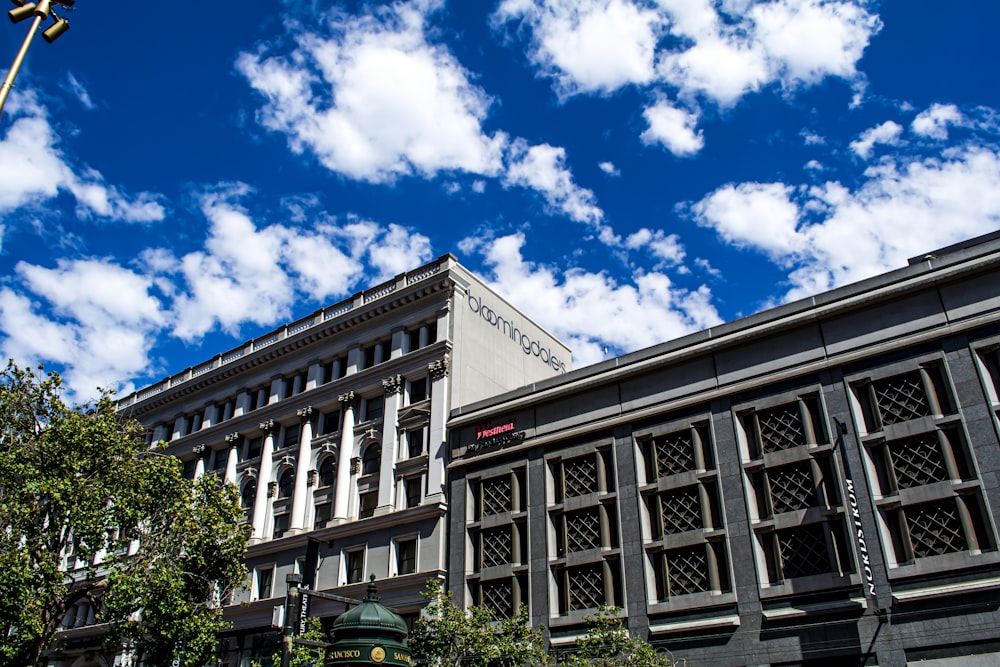 white and black concrete building under blue sky during daytime