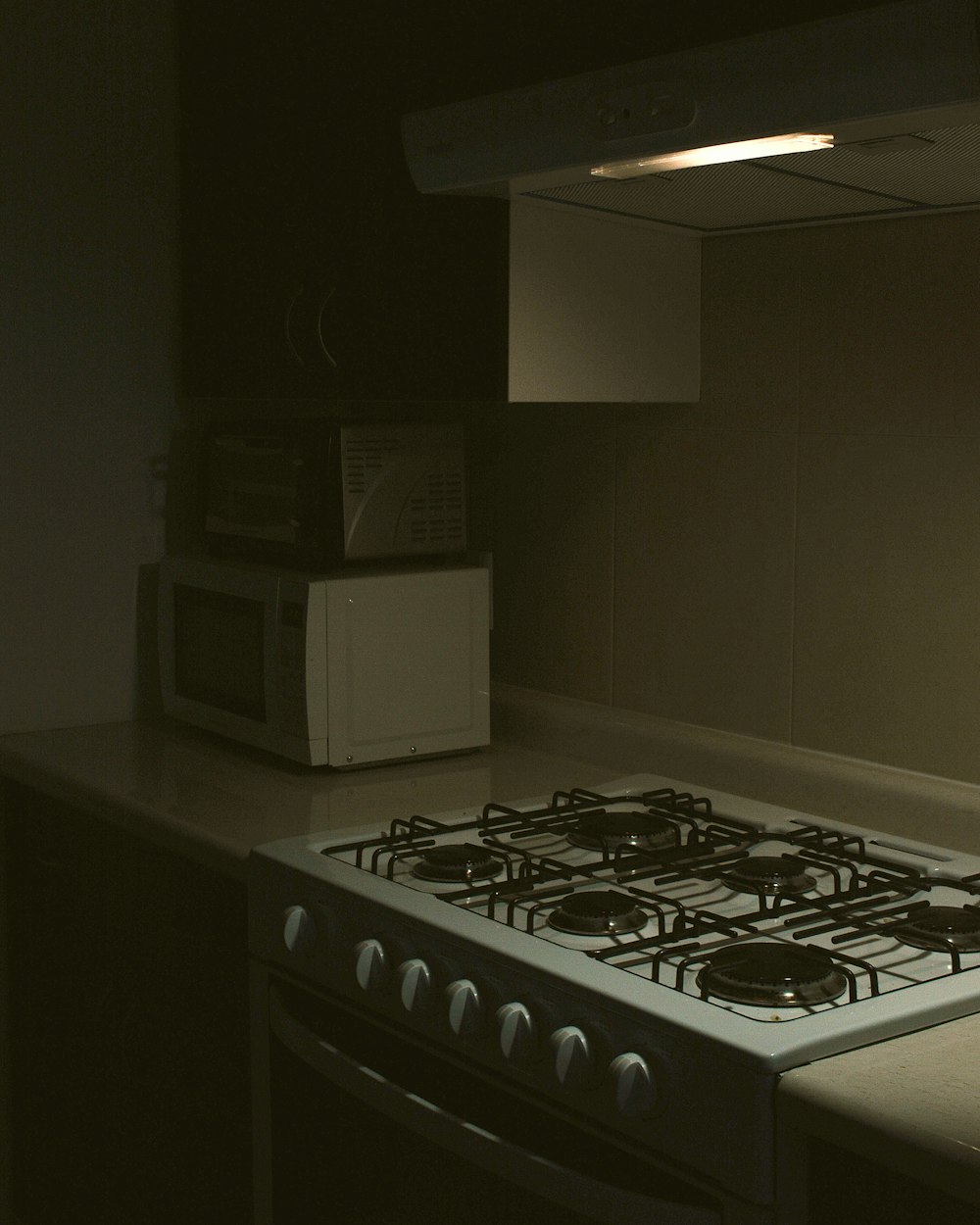 white microwave oven on black table