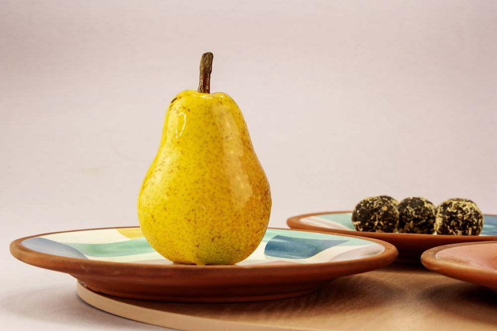 yellow fruit on white ceramic plate