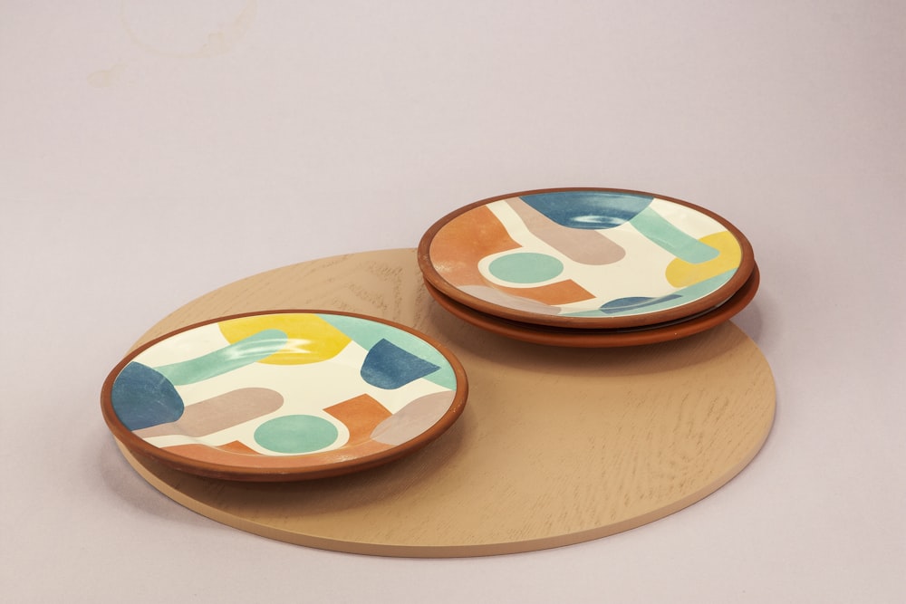 2 round brown wooden plates