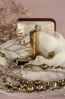 Display of elegant smoking accessories including lighters and cases.