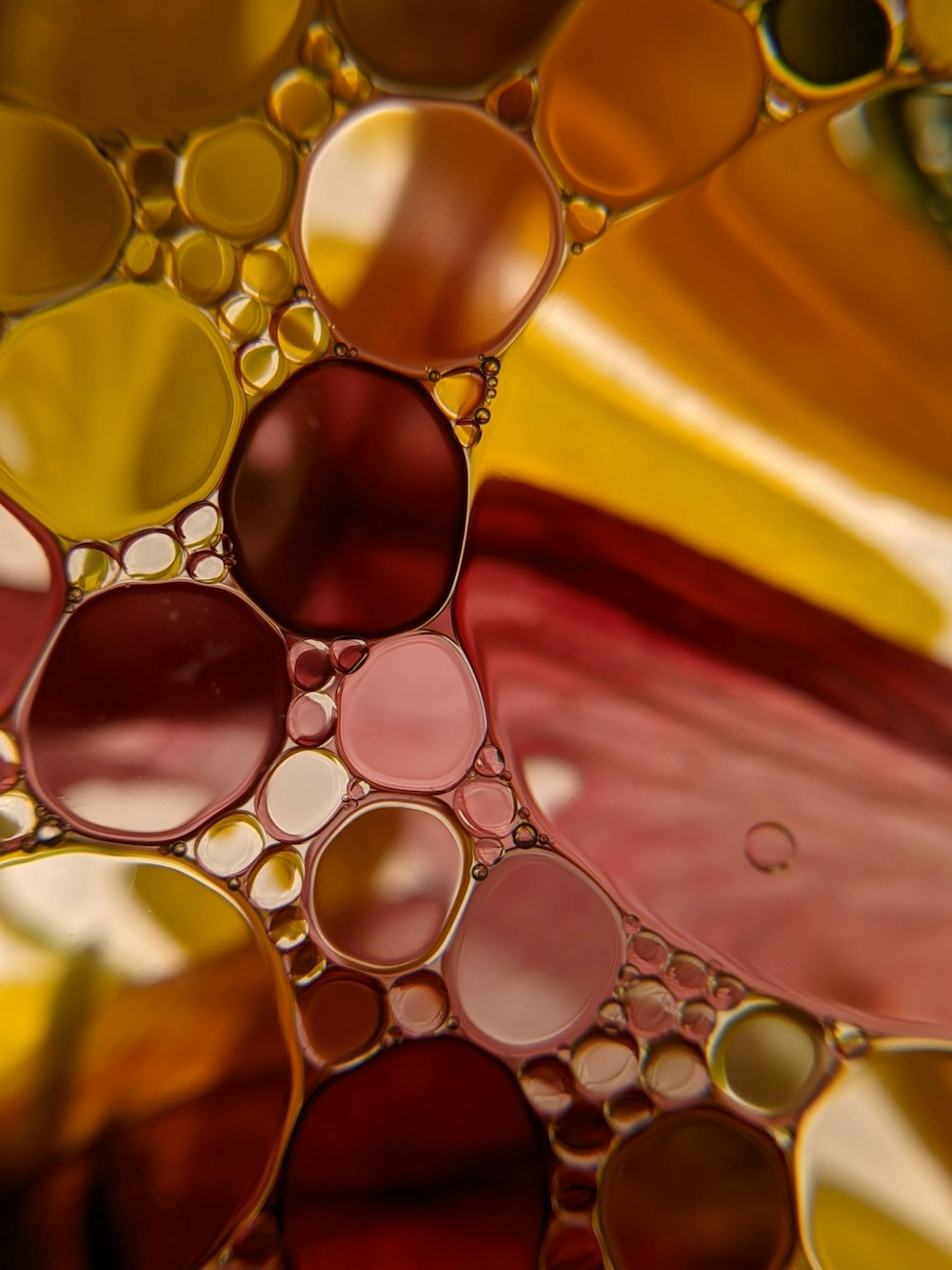 water droplets on yellow and red textile