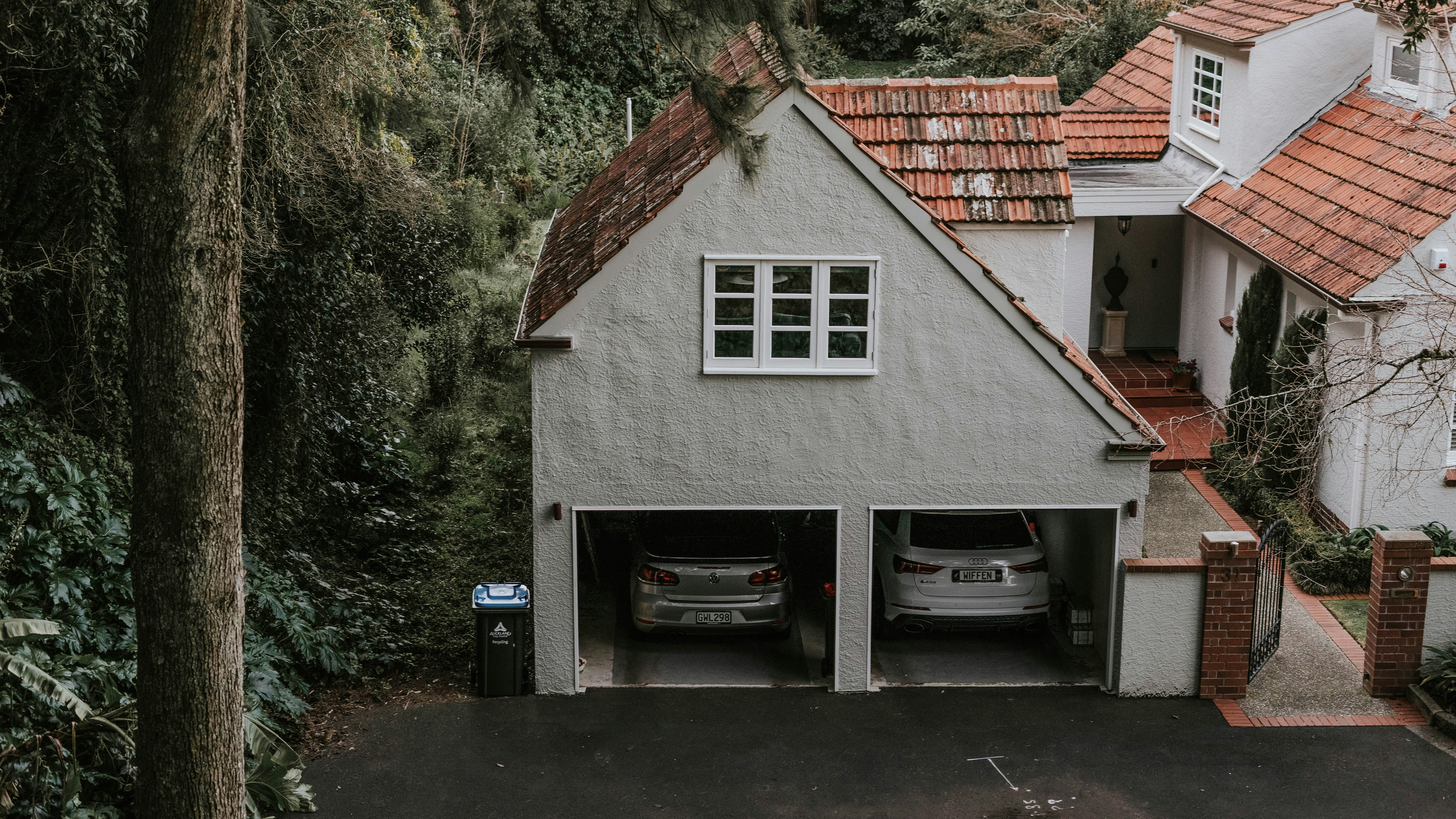 Family charging their electric car in a home garage