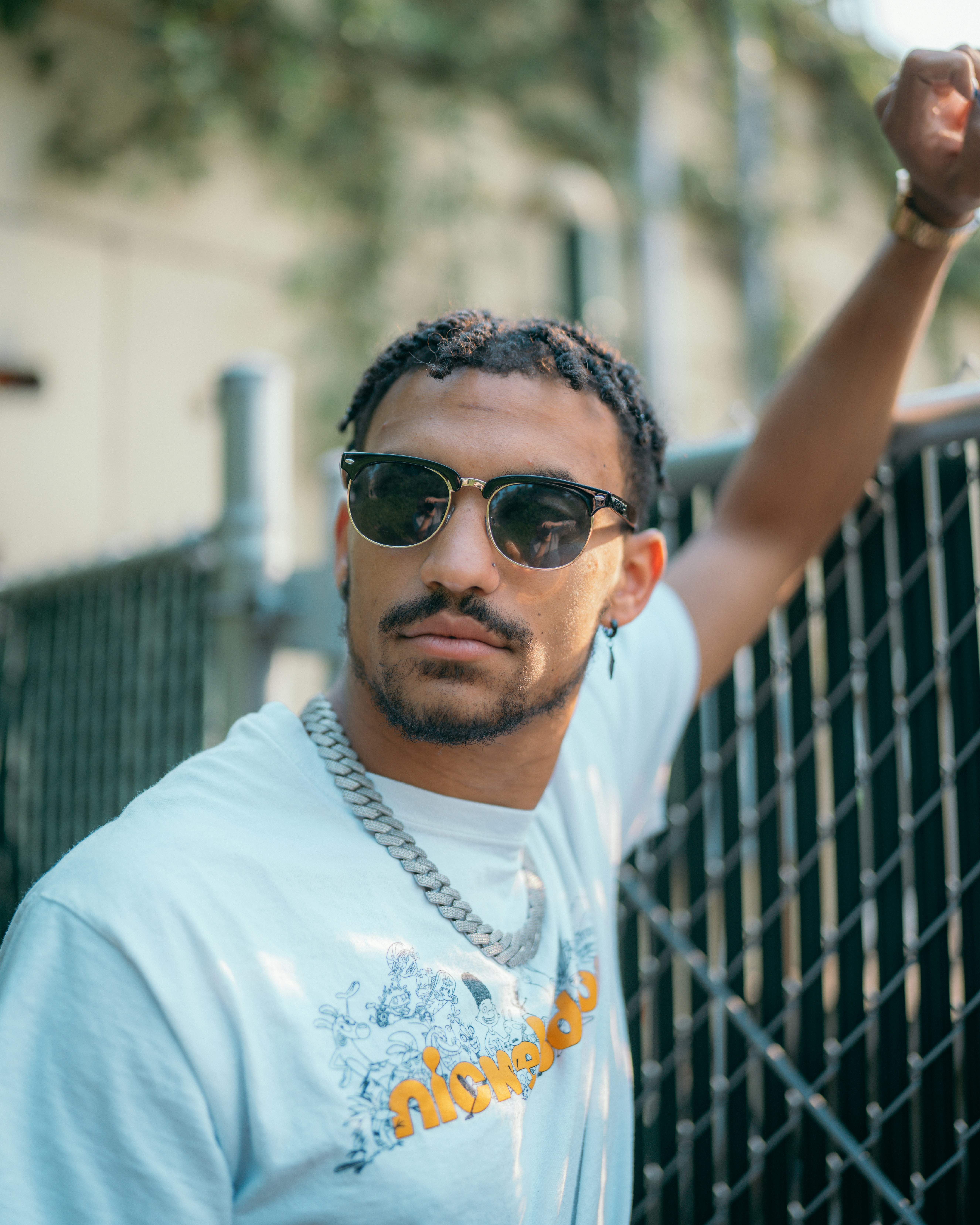 man in white crew neck t-shirt wearing black sunglasses