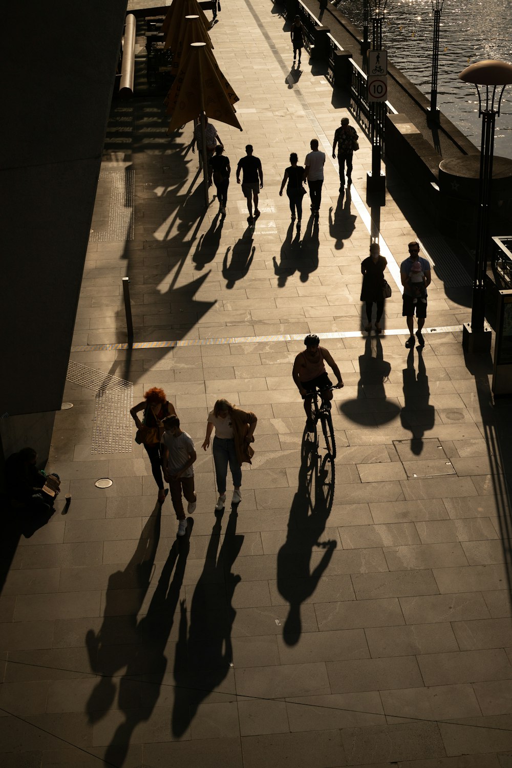 people walking on brown brick floor