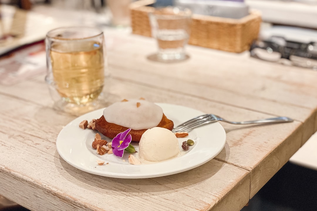 white ceramic plate with sliced bread and stainless steel fork