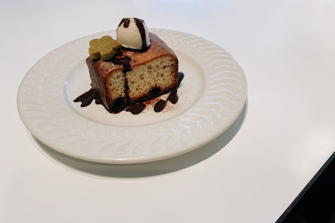 brown and white cake on white ceramic plate