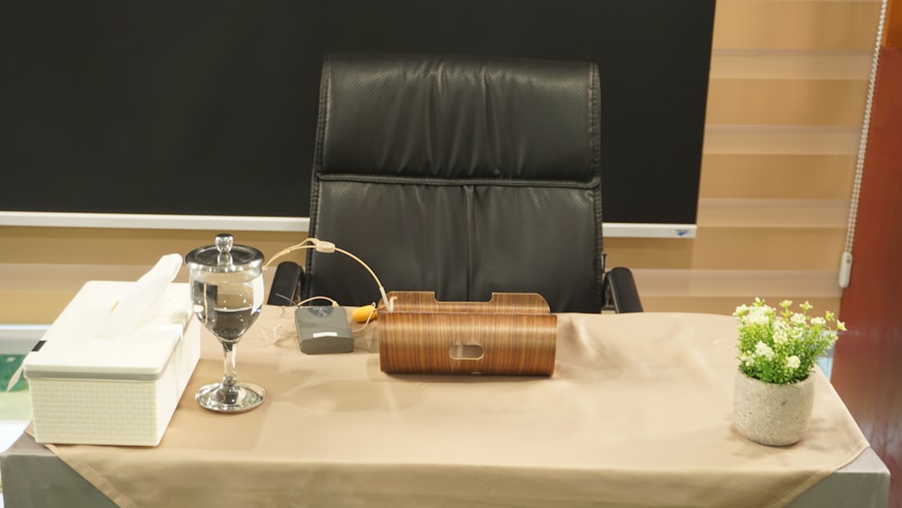 clear wine glass beside brown wicker basket on table