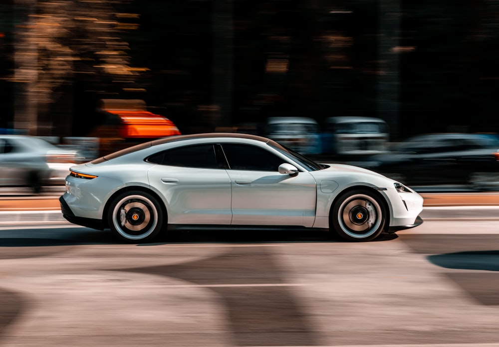 silver mercedes benz coupe on road during night time