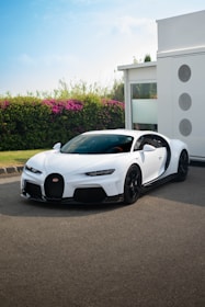 white lamborghini aventador parked near white concrete building during daytime