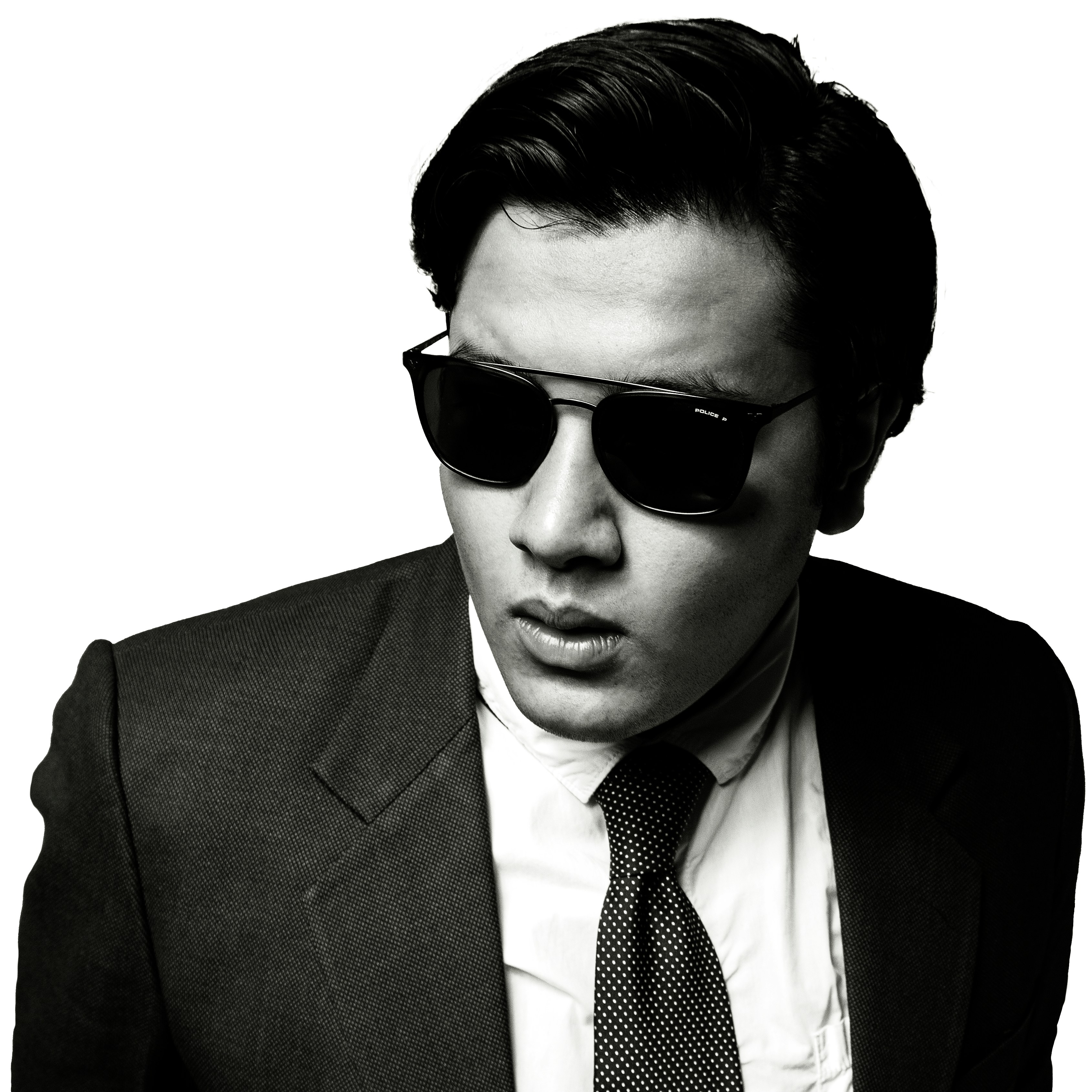 man in black suit wearing black sunglasses