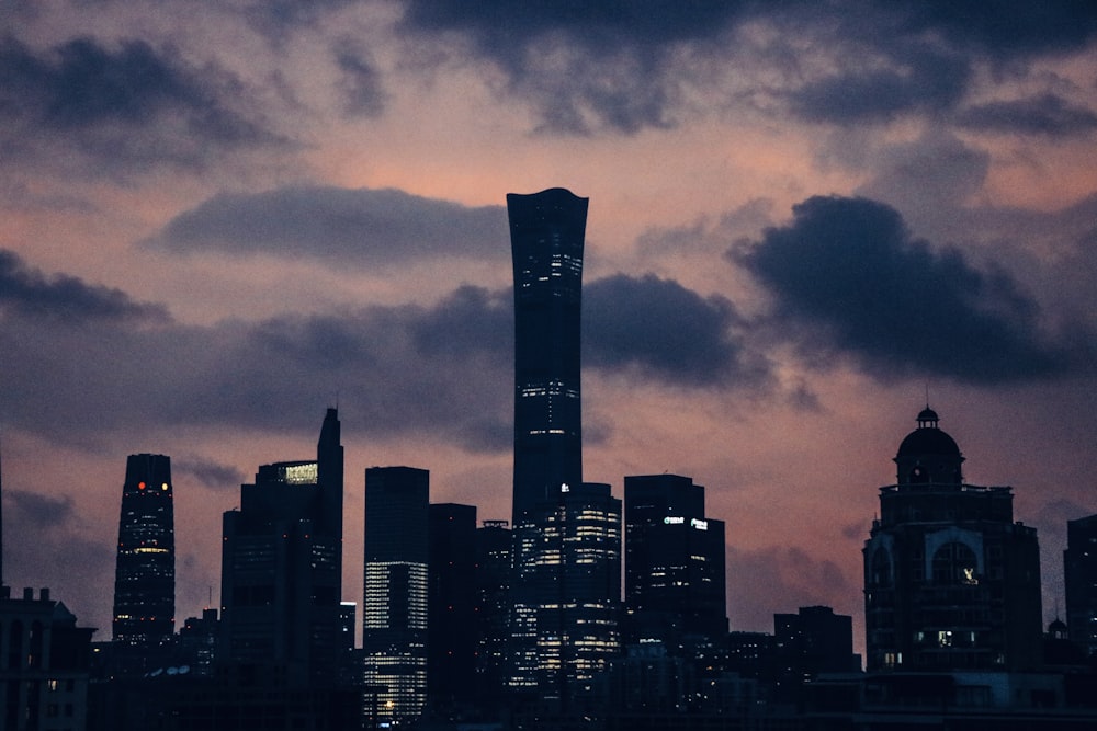 city skyline under dark cloudy sky