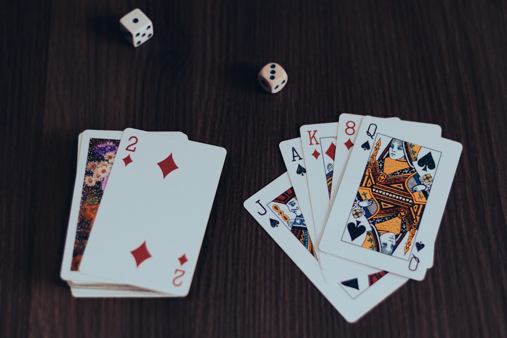 playing cards on brown wooden table