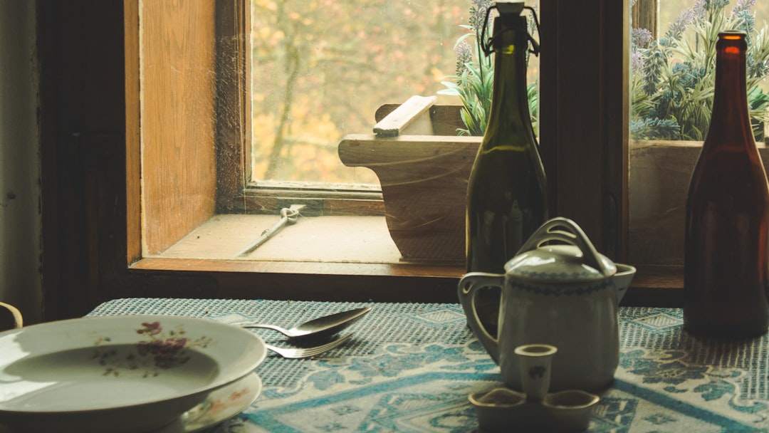 black ceramic teapot beside white ceramic bowl on table