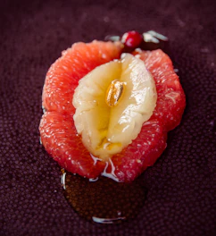 sliced strawberry fruit on black textile