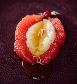 sliced strawberry fruit on black textile