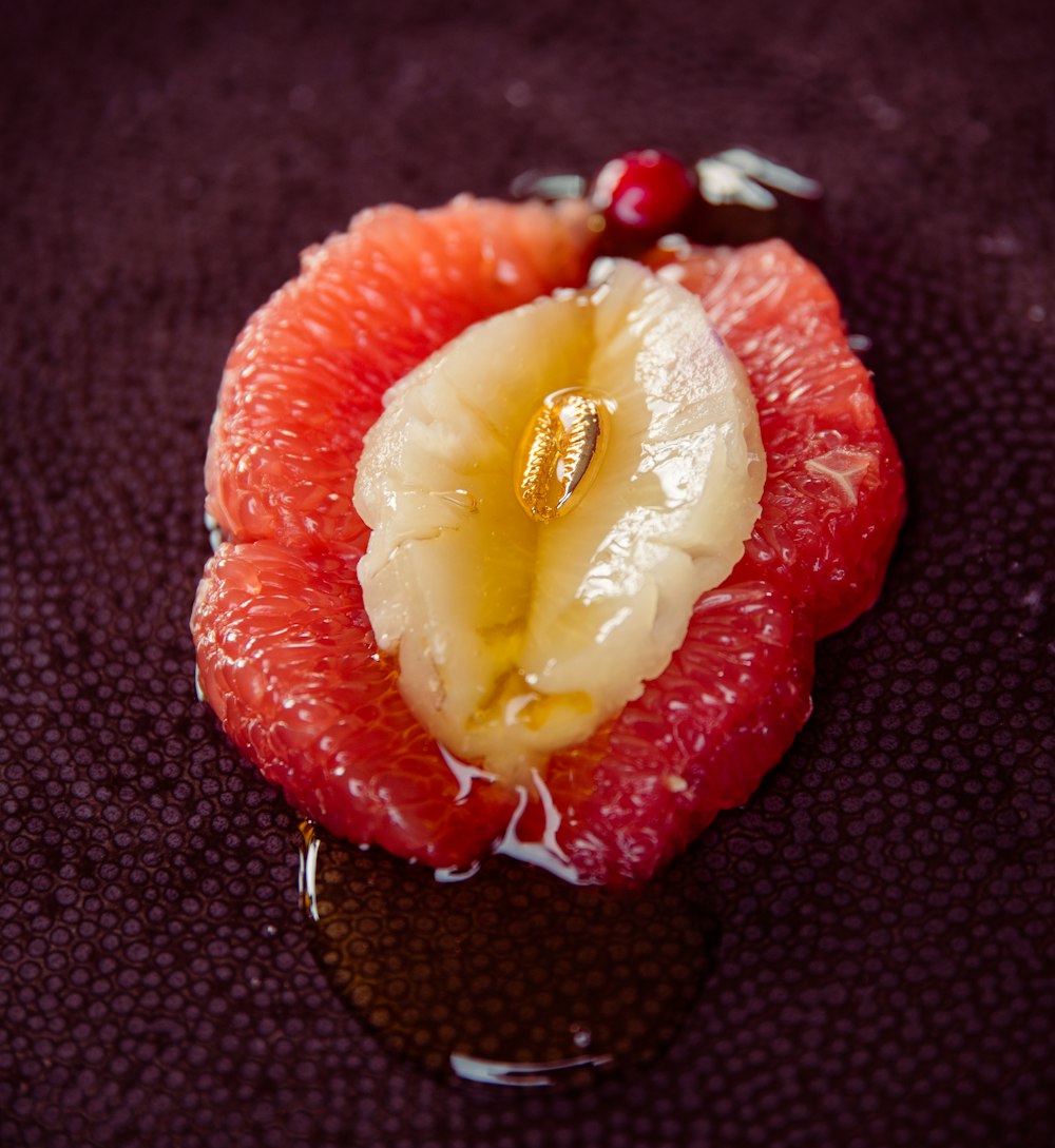 sliced strawberry fruit on black textile