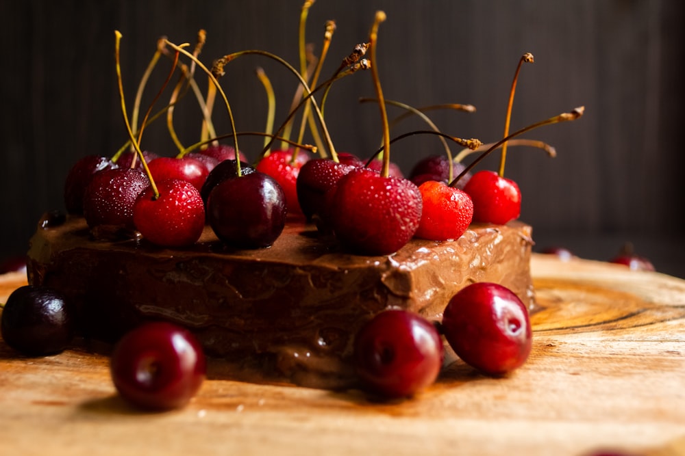 red cherries on brown wooden table