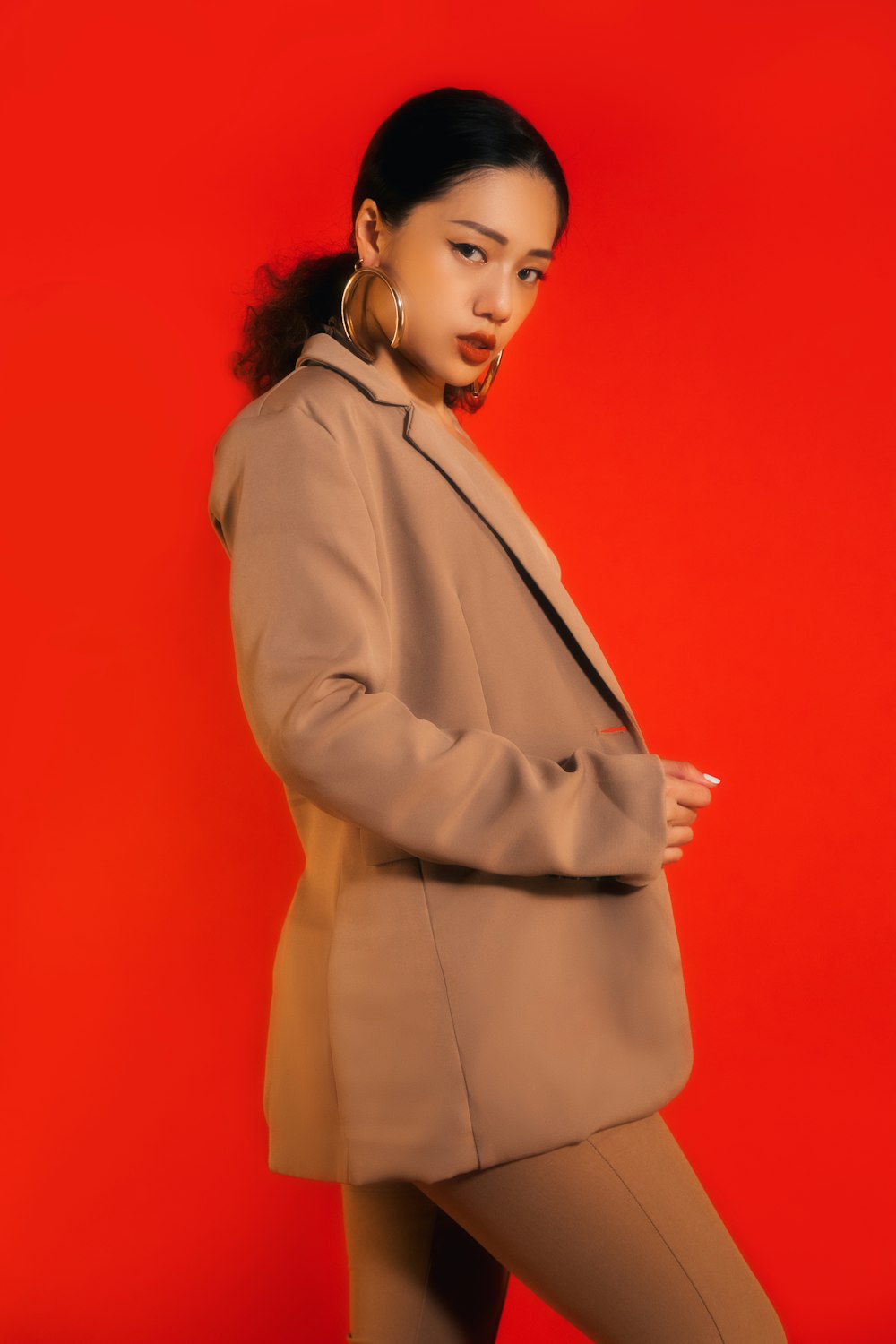 woman in brown coat standing