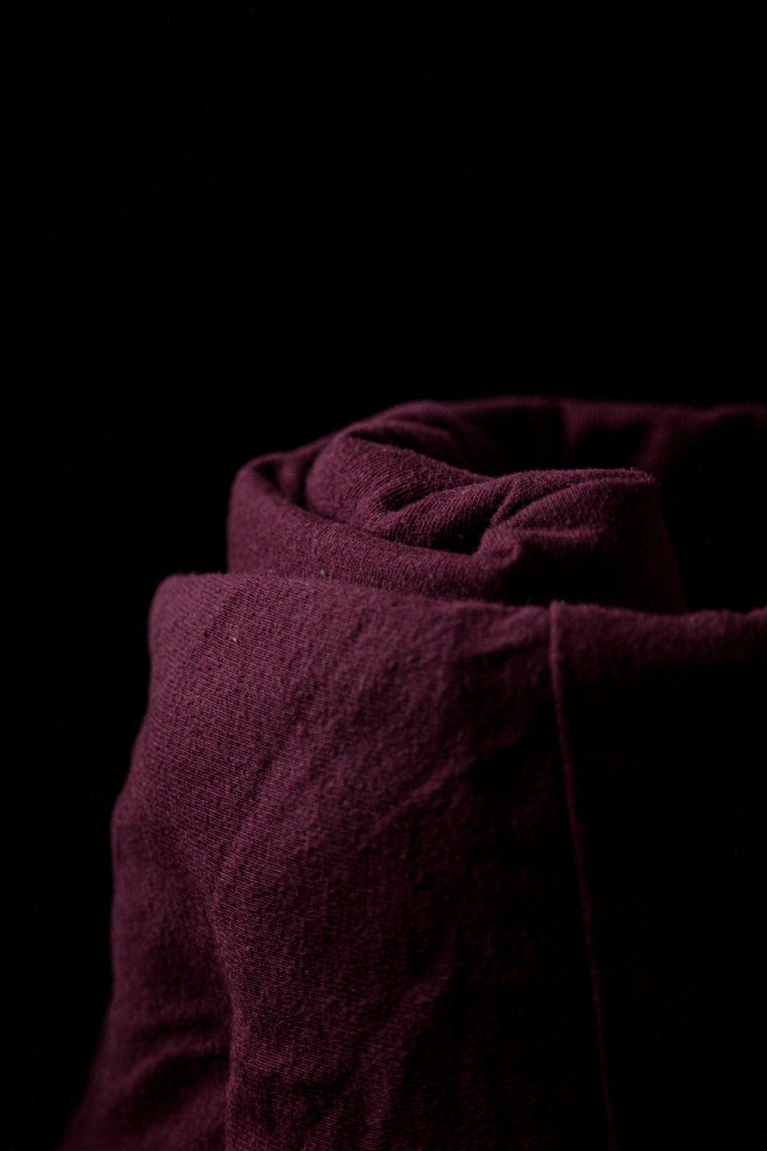 red textile in dark room