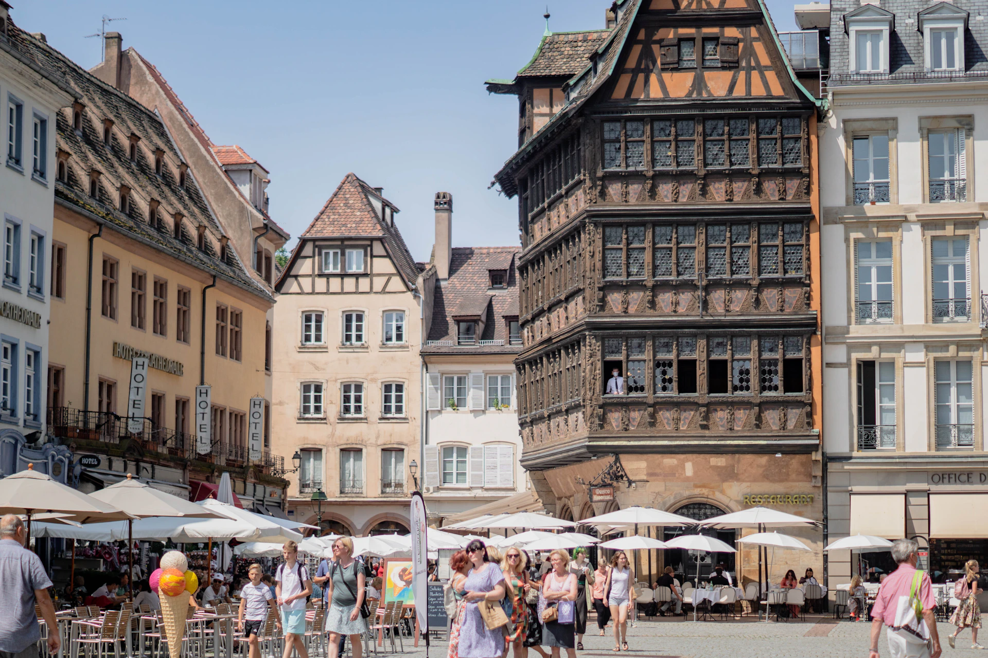 people walking on street near brown concrete building during daytime