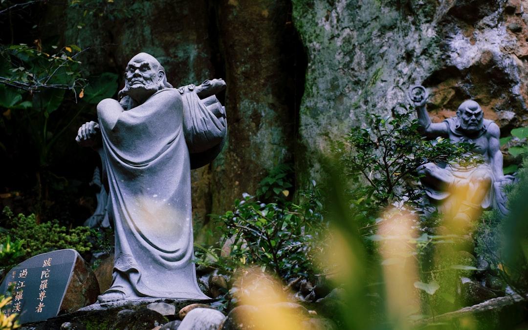 gray concrete statue of a man