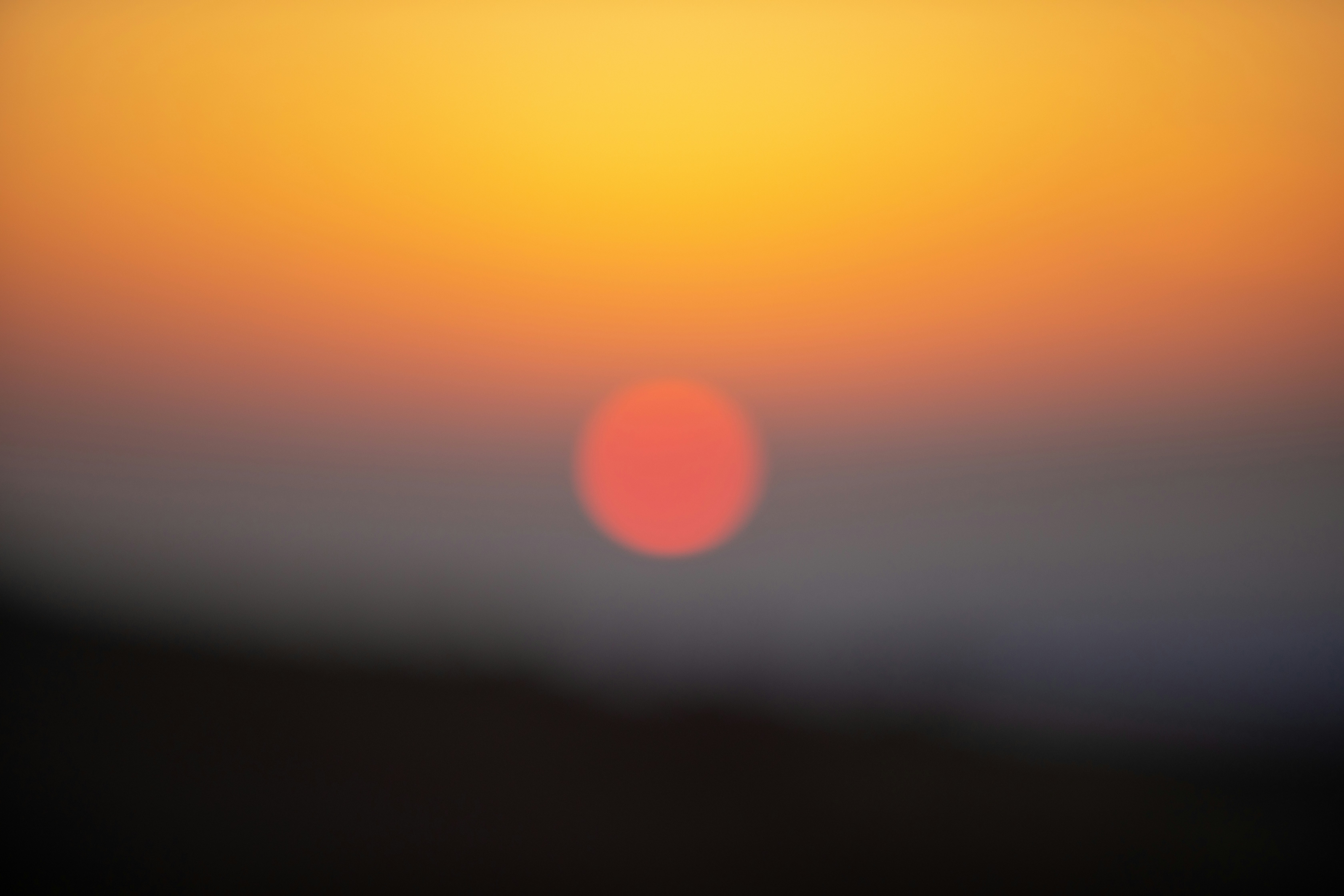 orange and yellow sun in the sky