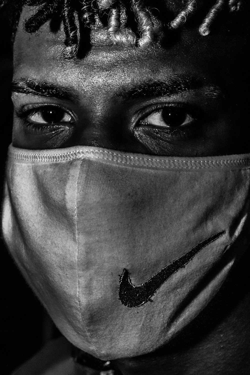 grayscale photo of person wearing mask