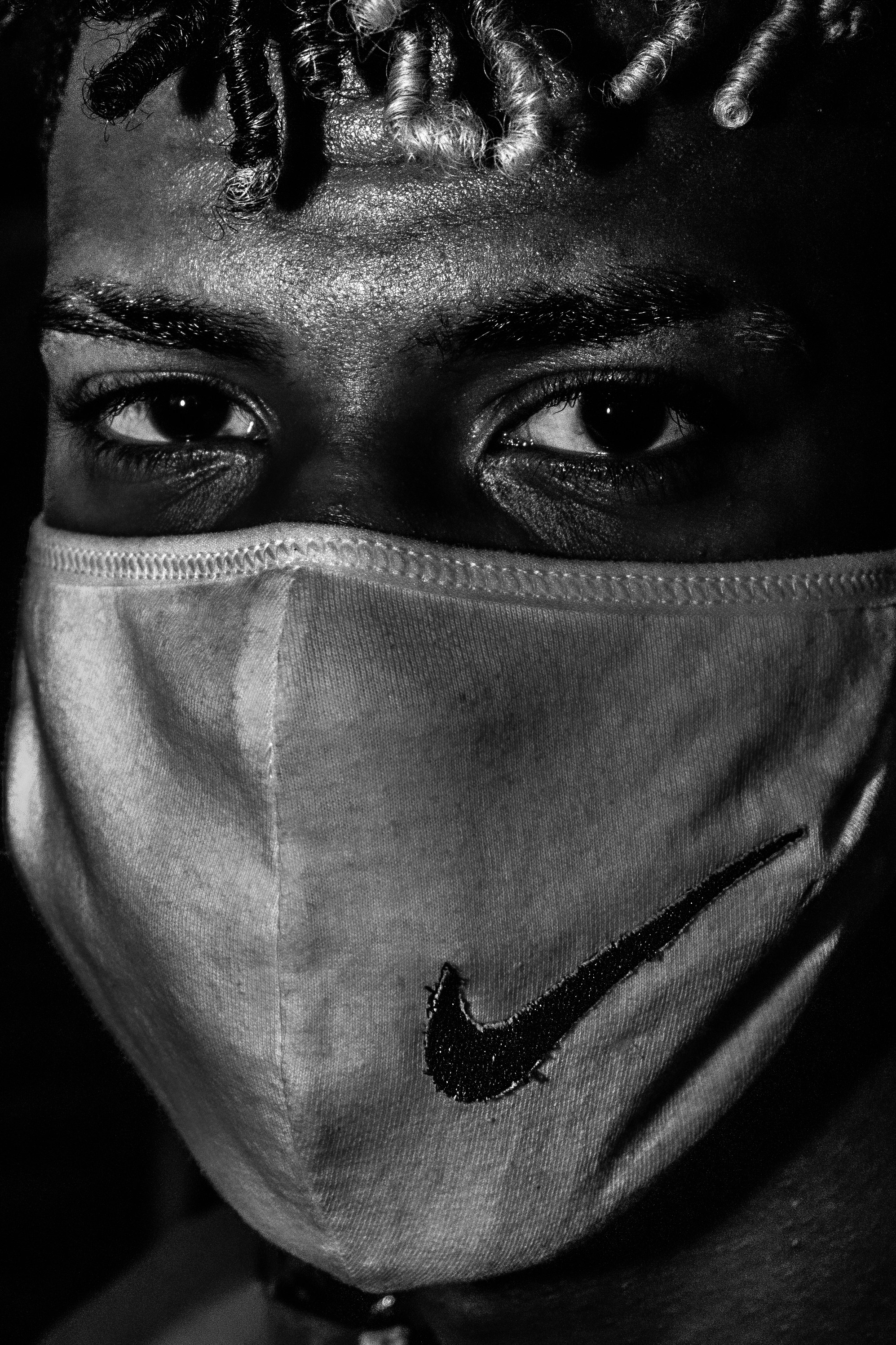 grayscale photo of person wearing mask