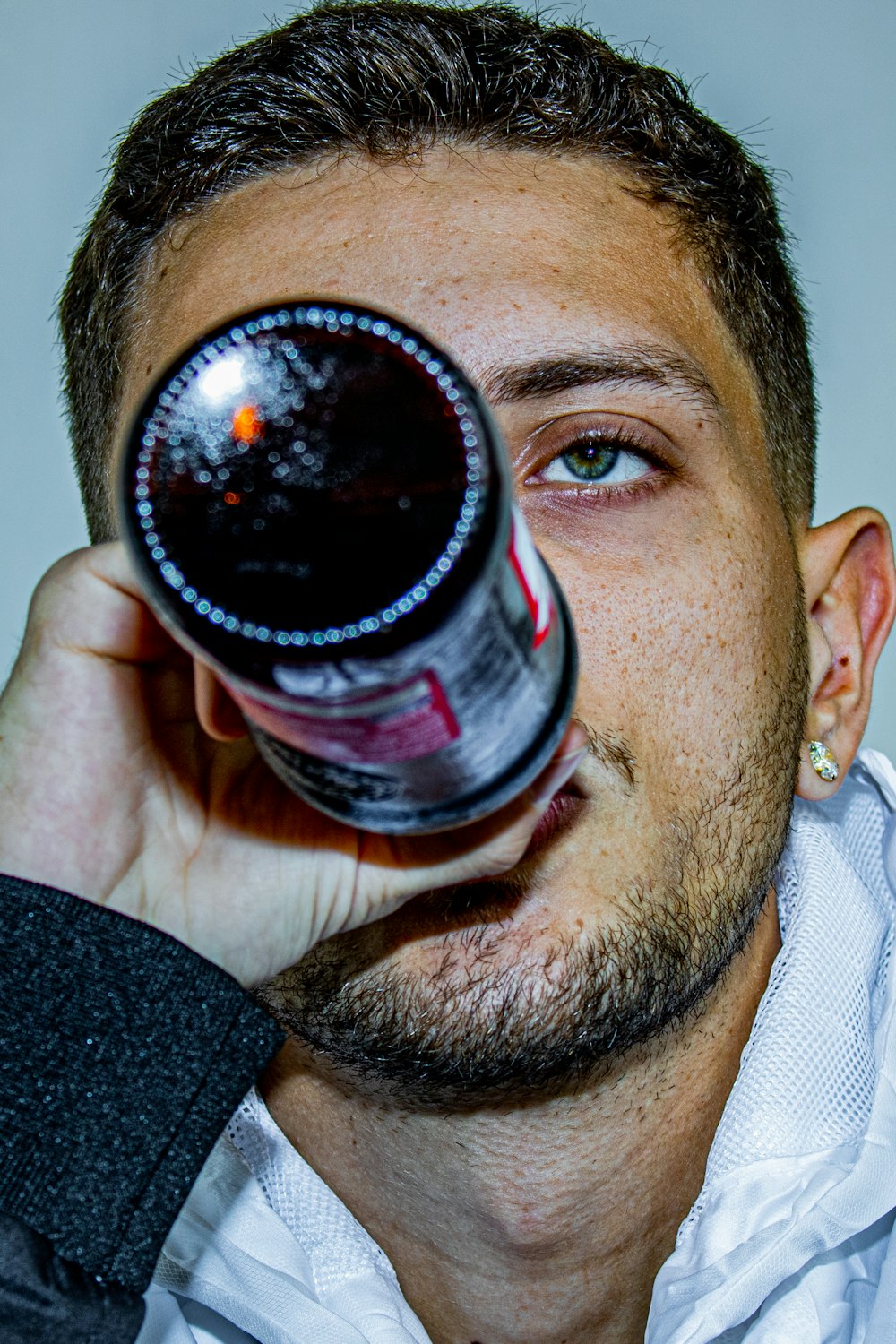 man holding coca cola bottle