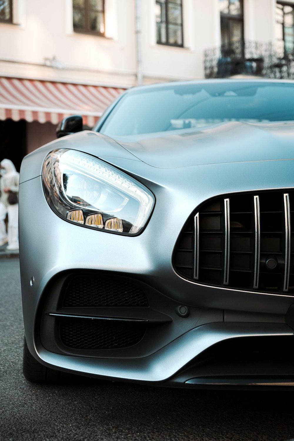 white mercedes benz car in close up photography