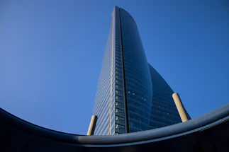 blue glass walled high rise building