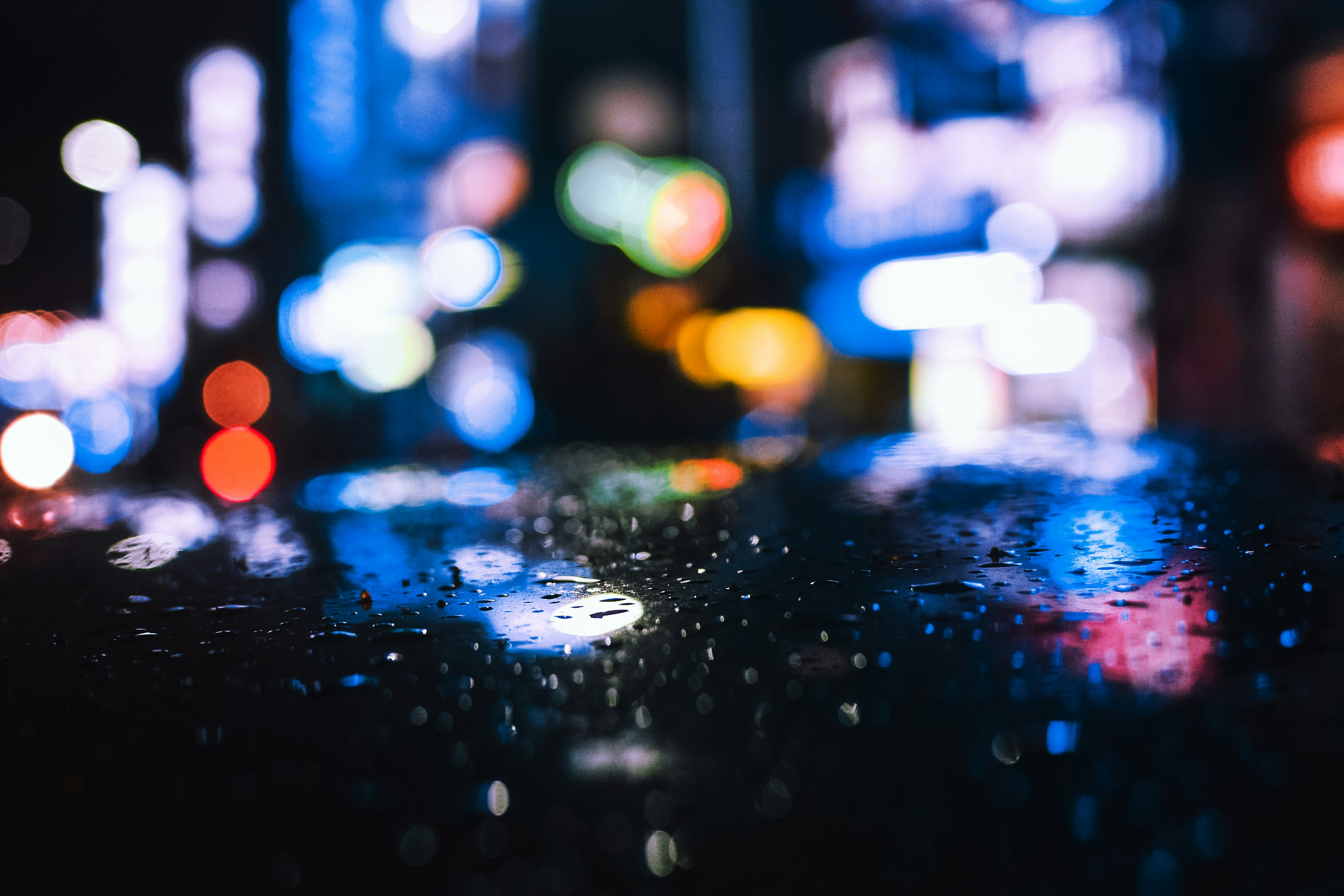 water droplets on glass during night time