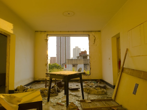 Restored living room with dry floors and sunlight streaming in through clean windows after water damage cleanup.
