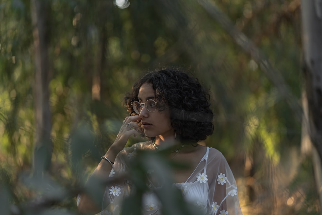 woman in white floral shirt