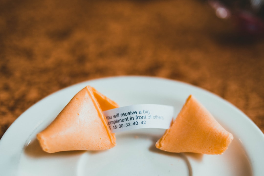 orange food on white ceramic plate